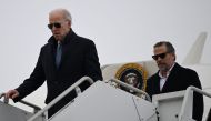 US President Joe Biden, with son Hunter Biden, arrives at Hancock Field Air National Guard Base in Syracuse, New York, on February 4, 2023. (Photo by ANDREW CABALLERO-REYNOLDS / AFP)
