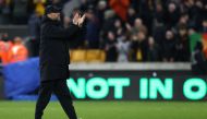 Liverpool's German manager Jurgen Klopp applauds at the end of the English Premier League football match between Wolverhampton Wanderers and Liverpool at the Molineux stadium in Wolverhampton, central England on February 4, 2023. (Photo by DARREN STAPLES / AFP)
