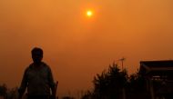 A man is seen during a fire in Santa Juana, Concepcion province, Chile on February 3, 2023. - Chile has declared a state of disaster in several central-southern regions after a devastating heat wave provoked forest fires that left four people dead, authorities said on Friday. (Photo by JAVIER TORRES / AFP)