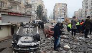 People search for survivors through the rubble in Diyarbakir, on February 6, 2023, after a 7.8-magnitude earthquake struck the country's south-east. Photo by ILYAS AKENGIN / AFP
