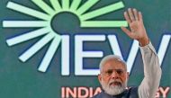 India's Prime Minister Narendra Modi waves at the crowd during the inauguration of 'India Energy Week 2023' under India's G20 Presidency, in Bengaluru on February 6, 2023. (Photo by Manjunath KIRAN / AFP)