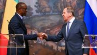 Russian Foreign Minister Sergei Lavrov shakes hands with Mali's Minister of Foreign Affairs and International Cooperation Abdoulaye Diop during a news conference, in Moscow, Russia, May 20, 2022. (Yuri Kadobnov/Pool via REUTERS/File Photo)