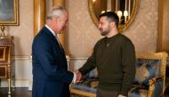 King Charles III shakes hands with Ukraine's President Volodymyr Zelensky at Buckingham Palace, in London, during his first visit to the UK since the Russian invasion of Ukraine. (Photo by Aaron Chown / POOL / AFP)