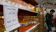 Oil bottles are displayed at a market selling food at discounted prices, after a devaluation of the Egyptian pound led to a sharp increase in prices, in Giza, Egypt, January 28, 2023. REUTERS/Hanaa Habib
