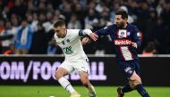 Marseille's French midfielder Valentin Rongier fights for the ball with Paris Saint-Germain's Argentine forward Lionel Messi during the French Cup round of 16 football match between Olympique Marseille (OM) and Paris Saint-Germain (PSG) at Stade Velodrome in Marseille, southern France on February 8, 2023. (Photo by CHRISTOPHE SIMON / AFP)