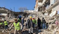 Turkish Hard Coal Enterprises (TTK) miners from Zonguldak take part in search operations in Antakya, on February 9, 2023, three days after a 7,8-magnitude earthquake struck southeast Turkey. (Photo by Remi BANET / AFP)