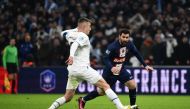 Marseille's French midfielder Valentin Rongier (L) fights for the ball with Paris Saint-Germain's Argentine forward Lionel Messi during the French Cup round of 16 football match between Olympique Marseille (OM) and Paris Saint-Germain (PSG) at Stade Velodrome in Marseille, southern France on February 8, 2023. (Photo by CHRISTOPHE SIMON / AFP)