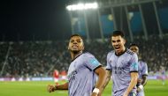 Real Madrid's Brazilian forward Rodrygo (left) celebrates scoring his team's third goal during the FIFA Club World Cup semi-final football match between Egypt's Al-Ahly and Spain's Real Madrid at the Prince Moulay Abdellah Stadium in Rabat on February 8, 2023. (Photo by Khaled DESOUKI / AFP)