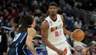 Miami Heat's Jimmy Butler (22) looks for a way around Orlando Magic's Cole Anthony, left, during the first half of an NBA basketball game, on February 11, 2023, in Orlando, Fla.John Raoux/AP
