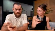This photo taken on February 9, 2023, shows Proud Mary owner Nolan Hirte (L) and project manager Brodie Roberts (R) sampling a brew of coffee at their cafe in Melbourne. (Photo by William West / AFP) 