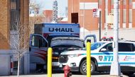 FEBRUARY 13: An NYPD vehicle is seen parked in front of a crashed U-Haul truck on Hamilton Avenue on February 13, 2023 in the Red Hook neighborhood of the Brooklyn borough in New York City. Photo by Michael M. Santiago / GETTY IMAGES NORTH AMERICA / Getty Images via AFP