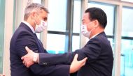 This Taiwan Ministry of Foreign Affairs (MOFA) handout picture taken and released on February 14, 2023 shows Paraguay's President Mario Abdo Benitez (L) greeting Taiwan Foreign Minister Joseph Wu at the Taoyuan International Airport near Taipei. (Photo by Handout / MOFA / AFP)