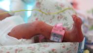 A newborn baby of a set of quintuplets lies in an incubator at the Obstetrics Department of the University Hospital in Krakow, southern Poland, 14 February 2023. Credit:Lukasz Gagulski / Avalon