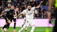 Real Madrid's French forward Karim Benzema takes a penalty kick and scores his team's third goal during the Spanish League match between Real Madrid CF and Elche CF at the Santiago Bernabeu stadium in Madrid on February 15, 2023. (Photo by JAVIER SORIANO / AFP)