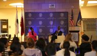 US Ambassador to  Qatar H E Timmy T Davis (right) and Co-president of the Black Students Association and moderator Michelle Siyabonga Hadebe during the event. 