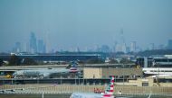 File photo: American Airlines planes taxi on the tarmac as the skyline of New York City is seen in the background from the JFK International Airport in New York, U.S., November 8, 2021. REUTERS/Eduardo Munoz