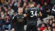 Arsenal's Ukrainian defender Oleksandr Zinchenko (left) celebrates with Arsenal's Swiss midfielder Granit Xhaka after scoring their second goal during the English Premier League match between Aston Villa and Arsenal at Villa Park in Birmingham, central England on February 18, 2023. (Photo by Geoff Caddick / AFP)