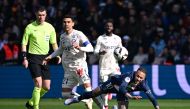 Paris Saint-Germain's Brazilian forward Neymar (right) falls, injured after a contact with Lille's French midfielder Benjamin Andre (centre) during the French L1 match between Paris Saint-Germain (PSG) and Lille LOSC at The Parc des Princes Stadium in Paris on February 19, 2023. (Photo by Anne-Christine POUJOULAT / AFP)