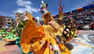 Dancers of the Waca Waca San Agustin group perform during the Oruro Carnival in Oruro, Bolivia, on February 18, 2023. (Photo by AIZAR RALDES / AFP)