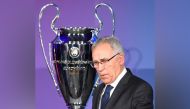 (FILES) In this file photo taken on April 27, 2015 former player of Spanish football club Real Madrid Amancio Amaro Varela gestures next to the trophy of the UEFA Champions League. (Photo by Tobias Schwarz / AFP)