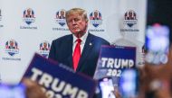 Former US President Donald Trump gestures to supporters during Trump's President Day event at the Hilton Palm Beach Airport in West Palm Beach, Florida, on February 20, 2023. (Photo by GIORGIO VIERA / AFP)