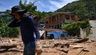 A man is seen at a flood-affected area in Barra do Sahy, Sao Sebastiao district, Sao Paulo state, Brazil on February 21, 2023. - Lifeguards continued to search for survivors on the Sao Paulo coast, where the heaviest rains in Brazil's history left at least 44 dead and dozens missing over the weekend, authorities said Tuesday. (Photo by NELSON ALMEIDA / AFP)
 