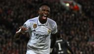 Real Madrid's Brazilian Vinicius Junior celebrates scoring the team's second goal during the UEFA Champions League last 16 first leg match between Liverpool and Real Madrid at Anfield in Liverpool, north west England on February 21, 2023. (Photo by Paul ELLIS / AFP)