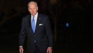 US President Joe Biden walks from Marine One after arriving on the South Lawn of the White House in Washington, DC, February 22, 2023, following a trip to Ukraine and Poland.  (Photo by SAUL LOEB / AFP)