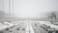 Traffic is moving on interstate 35W during a snowstorm in Minneapolis, Minnesota, on February 22, 2023. Photo by Craig LASSIG / AFP