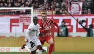 Leverkusen's French forward Moussa Diaby (left) and Freiburg's Austrian defender Philipp Lienhart vie for the ball during the German first division Bundesliga match between SC Freiburg v Bayer Leverkusen in Freiburg, southwestern Germany, on February 26, 2023. (Photo by Thomas KIENZLE / AFP)