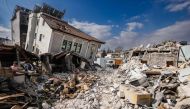 This photograph shows collapsed buildings in the city of Antakya on February 19, 2023. (Photo by Sameer Al-Doumy / AFP)
