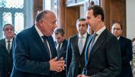 This handout picture released by the Egyptian Foreign Ministry shows Egypt's Foreign Minister Sameh Shoukry (left) meeting with Syrian President Bashar al-Assad in Damascus on February 27, 2023.  (Photo by AFP)