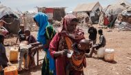 A mother gives water to her child at a camp for displaced persons in Baidoa, Somalia. Hungry people are heading to Baidoa from rural areas of southern Somalia, one of the regions hardest hit by drought. File photo / AFP