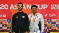  Qatar head coach Inaki Abadia with Iran coach Abdolsamad Marfavi at a pre-match press conference yesterday.