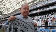 Former French football player Just Fontaine shows his jersey before the start of the French L1 football match Olympique de Marseille (OM) versus Toulouse at the Velodrome stadium in Marseille, on October 19, 2014. Photo by BORIS HORVAT / AFP