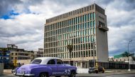 A classic American car passes the US embassy in Havana last year. File photo / AFP

