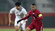 Action during the match between Qatar and Iran yesterday.
