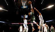 Giannis Antetokounmpo #34 of the Milwaukee Bucks shoots against Nic Claxton #33 of the Brooklyn Nets during their game at Barclays Center on February 28, 2023 in New York City.  Al Bello/Getty Images/AFP