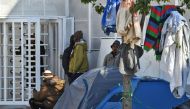 Sub-Saharan African migrants camp outside the headquarters of the International Organisation for Migration (IOM) in Tunis, on March 2, 2023. - After President Kais Saied ordered 