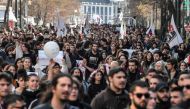 Protesters march during a demonstration of students and pupils in central Athens on March 3, 2023, following a deadly train accident near the city of Larissa, where at least 57 people, most of them students, lost their lives. (Photo by Louisa Gouliamaki / AFP)