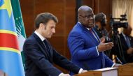 Democratic Republic of Congo's President Felix Tshisekedi (R) and France's President Emmanuel Macron hold a press conference during their meeting at the Palace of the Nation in Kinshasa, on March 4, 2023. (Photo by Ludovic Marin / AFP)