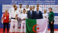 Team Algeria judokas pose for a photograph with officials. 