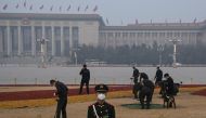 :A security officer stands outside the Great Hall of the People ahead of the opening session of the National People's Congress (NPC) in Beijing on March 5, 2023. (Photo by NOEL CELIS / AFP)
