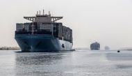 A container ship sails through the new section of the Suez Canal in the Egyptian port city of Ismailia, 135 kilometers northeast of the capital Cairo on October 10, 2019. File photo / AFP
