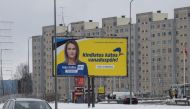 An election poster featuring Prime Minister Kaja Kallas of the Reform Party is seen in Viimsi, Estonia on March 5, 2023 during parliamentary elections. - According to the polls, the elections are set to be won by the Reform Party of Prime Minister Kaja Kallas, who has led international calls for increased military assistance to Ukraine. (Photo by RAIGO PAJULA / AFP)