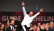 Alexandre Couillon celebrates after being awarded a third Michelin star, during the 2023 edition of the Michelin guide awards ceremony on March 6, 2023 in Strasbourg, eastern France. (Photo by PATRICK HERTZOG / AFP)