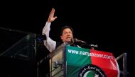 File Photo: Former Pakistani Prime Minister Imran Khan gestures as he addresses supporters during a rally, in Lahore, Pakistan April 21, 2022. (REUTERS/Mohsin Raza)

