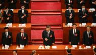 China's President Xi Jinping (centre) is applauded as he arrives for the second plenary session of the National People's Congress (NPC) at the Great Hall of the People in Beijing on March 7, 2023. (Photo by Greg Baker / AFP)
 