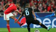 Benfica's Brazilian midfielder David Neres (L) scores his team's fifth goal during the UEFA Champions League round of 16 second leg football match between SL Benfica and Club Brugge at the Luz stadium in Lisbon on March 7, 2023. (Photo by CARLOS COSTA / AFP)