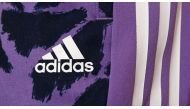 The logo of the German sports equipment maker Adidas is pictured prior to the company's annual press conference in Herzogenaurach, southern Germany on March 8, 2023. (Photo by Christof STACHE / AFP)